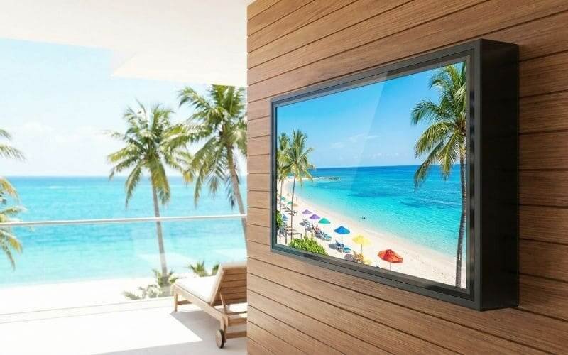 Outdoor TV enclosure installed on beachfront balcony